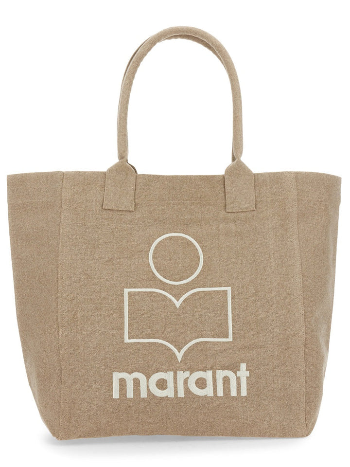 Beige tote bag with a logo and 'marant' text on a white background