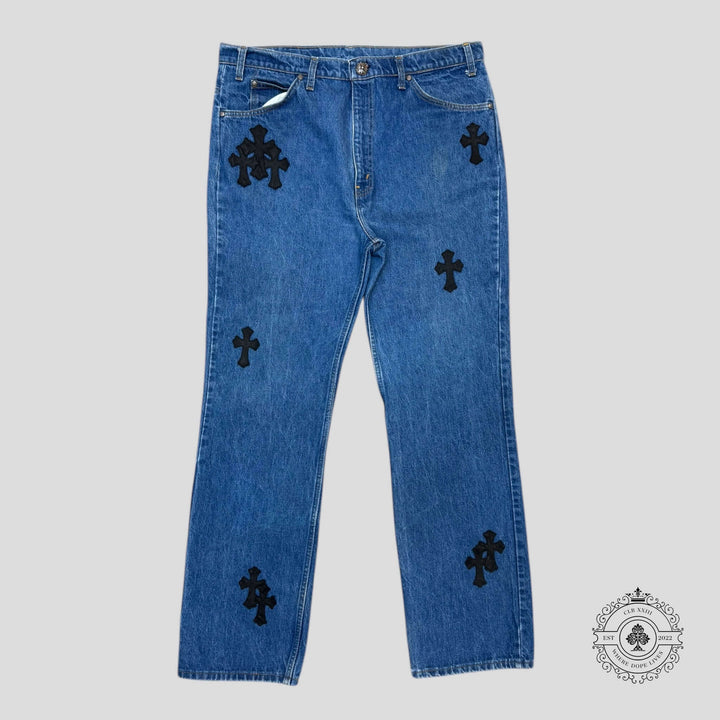 Chrome Hearts Cross Patch Levis featuring rare dark indigo denim and .925 sterling silver hardware, a must-have for luxury denim enthusiasts.