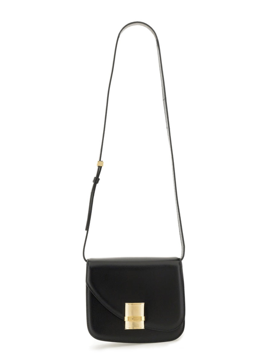 Black handbag with a gold clasp on a white background