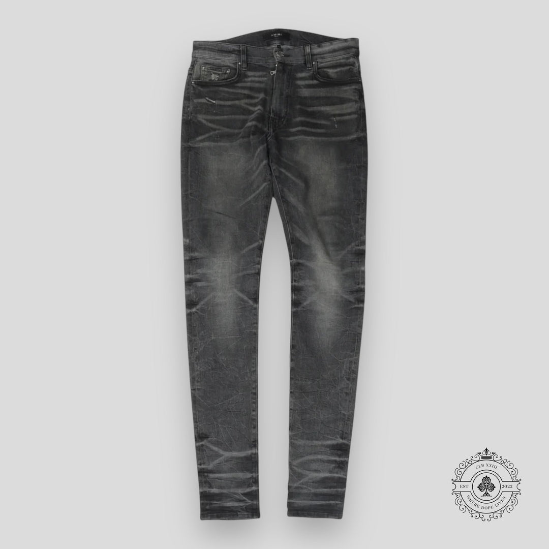 Amiri Faded Denim Jeans in Grey