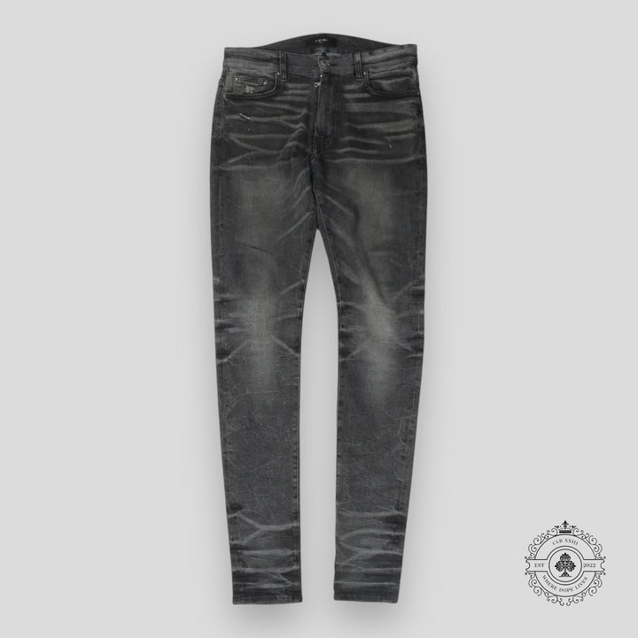 Amiri Faded Denim Jeans in Grey