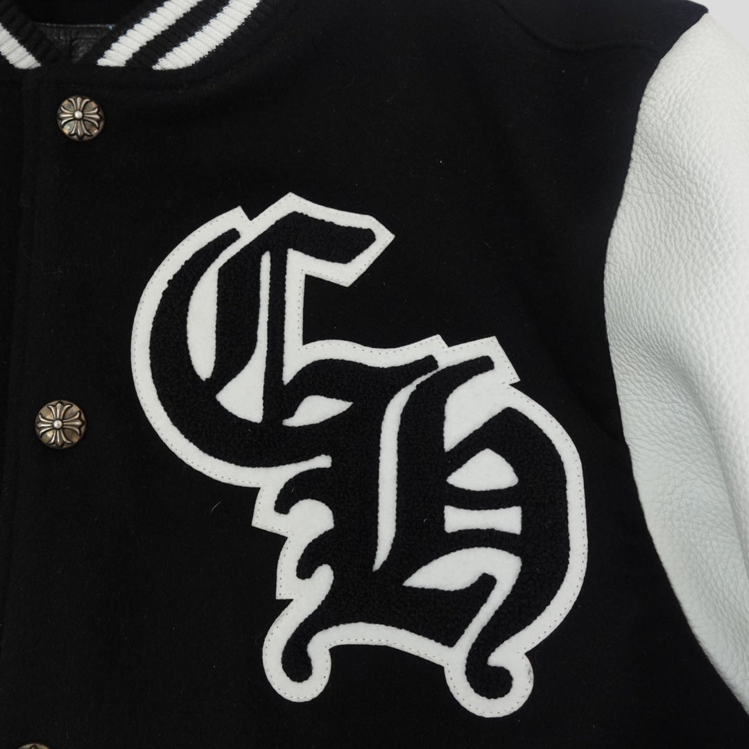 Black letterman jacket with white emblem and buttons
