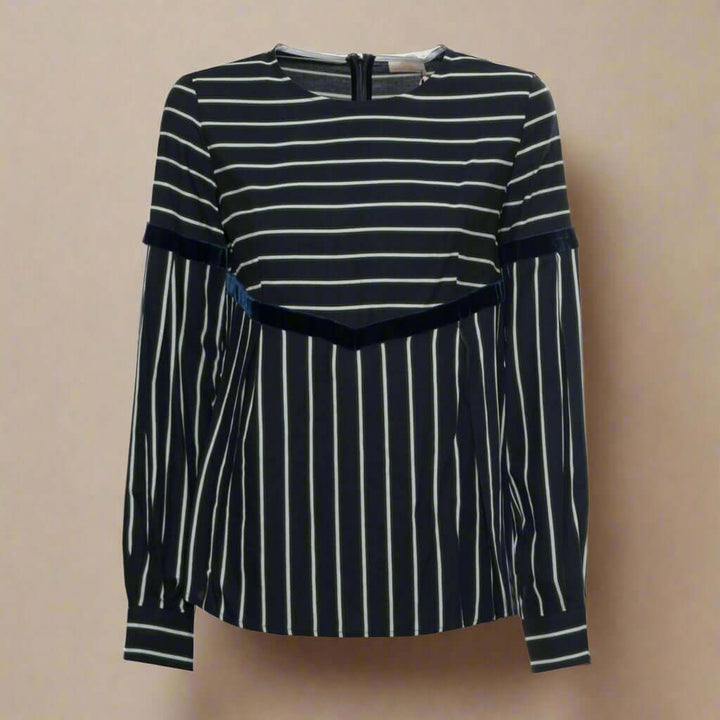 Black and white striped long-sleeve top on a white background