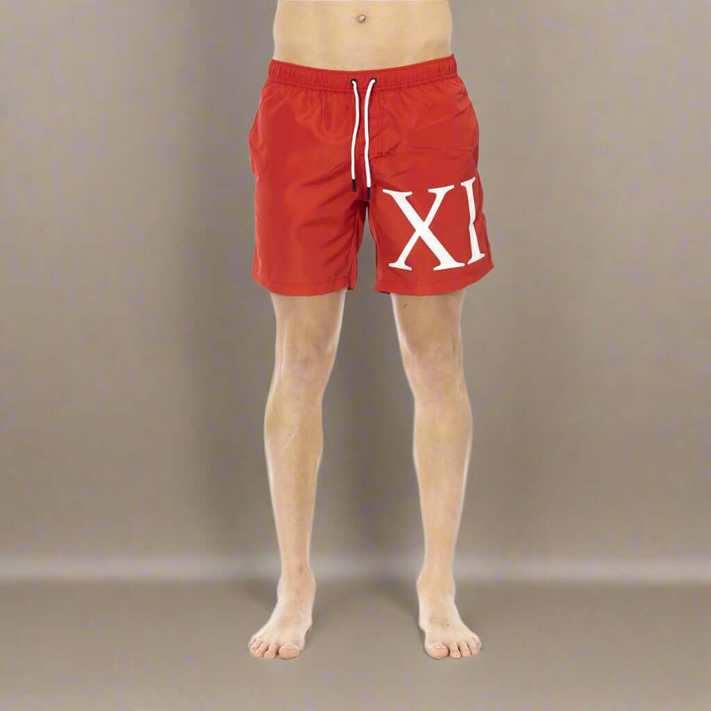 Men’s Bikkembergs beachwear and swimwear collection at STORE 7994 featuring modern swim trunks and sporty beach styles for summer.