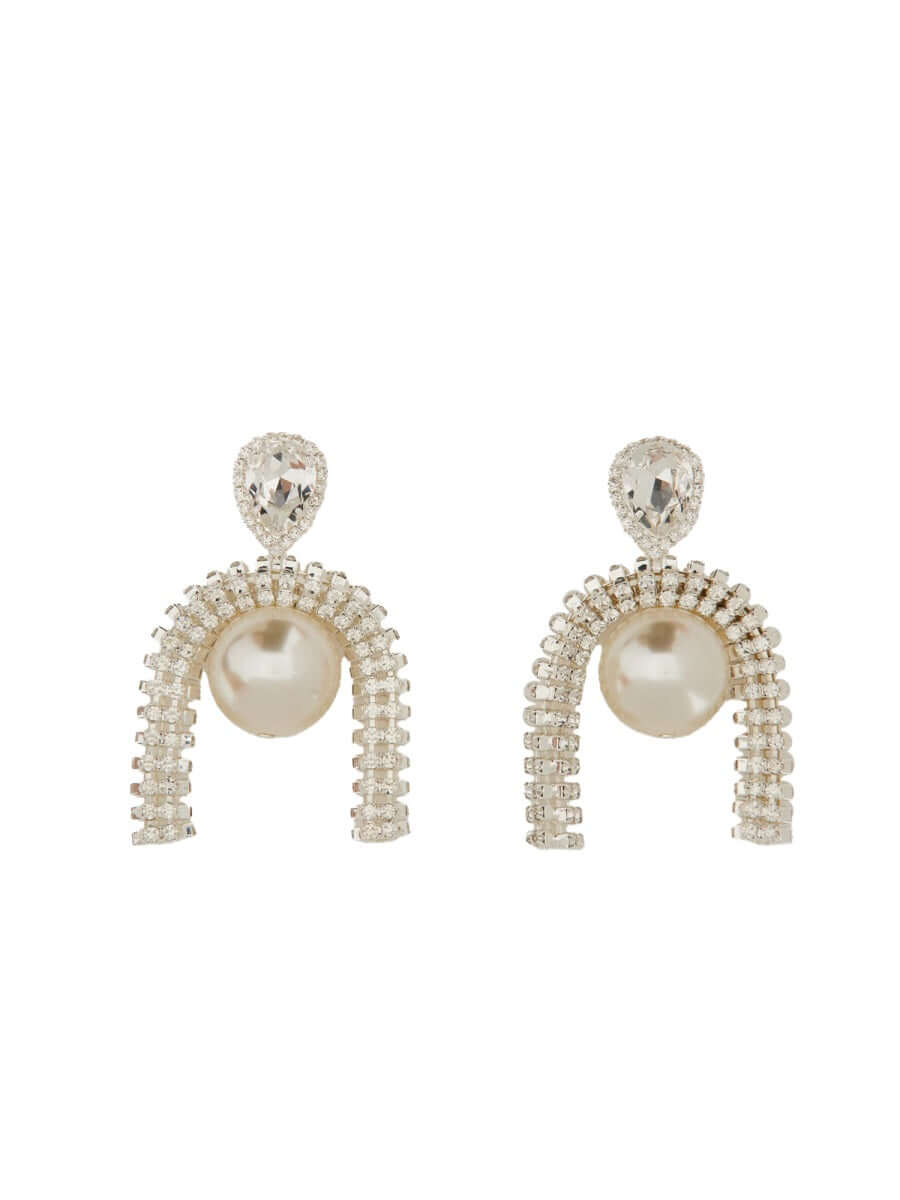 Pair of pearl and crystal earrings on a white background