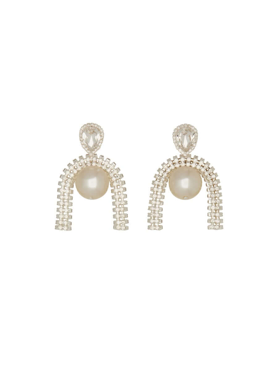 Pair of earrings with pearl-like beads and crystal-like elements on a white background