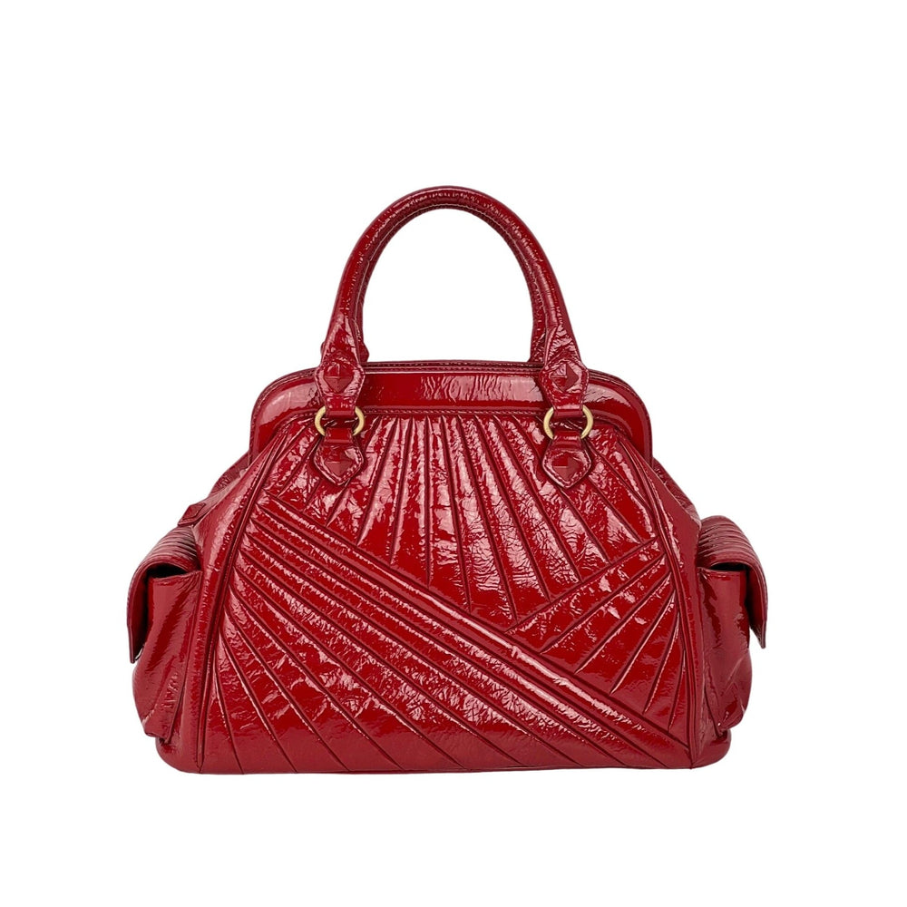 Isabella Fiore Red Patent Leather Hand bag, a pre-owned luxury bag with a unique quilted design and double handles.