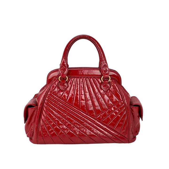 Isabella Fiore Red Patent Leather Hand bag, a pre-owned luxury bag with a unique quilted design and double handles.