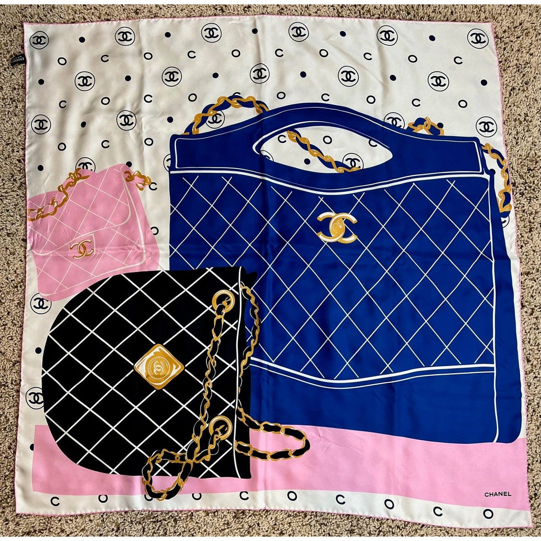 Chanel scarf with handbag design and logo on a beige background