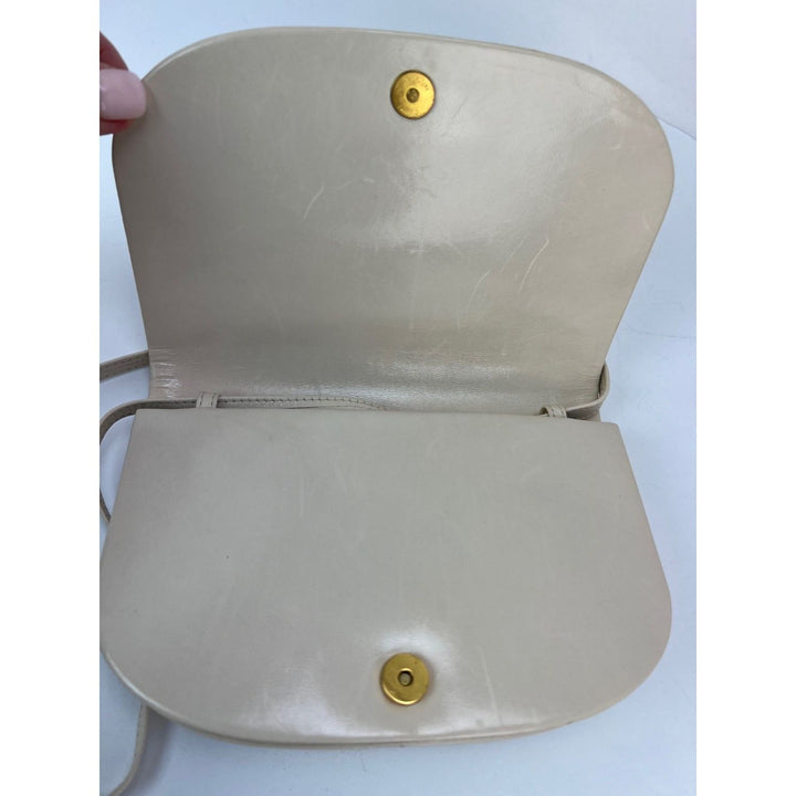 Bottega Veneta Intreciato white leather Shoulder Clutch Bag interior view, showcasing magnetic snap closure.