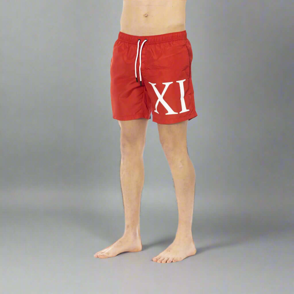Men’s Bikkembergs beachwear and swimwear collection at STORE 7994 featuring modern swim trunks and sporty beach styles for summer.