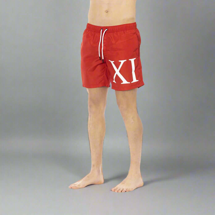 Men’s Bikkembergs beachwear and swimwear collection at STORE 7994 featuring modern swim trunks and sporty beach styles for summer.