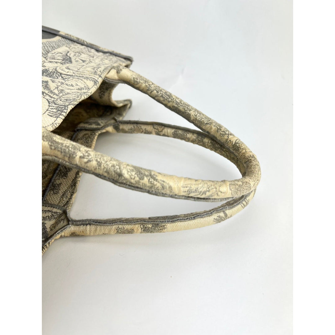 Close-up of a decorative metal object with intricate designs on a white background