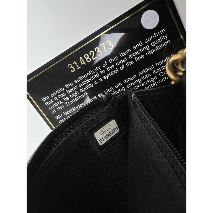 Chanel Caviar Quilted Mini Boy Clutch Wallet on a Chain Black authenticity card and interior details