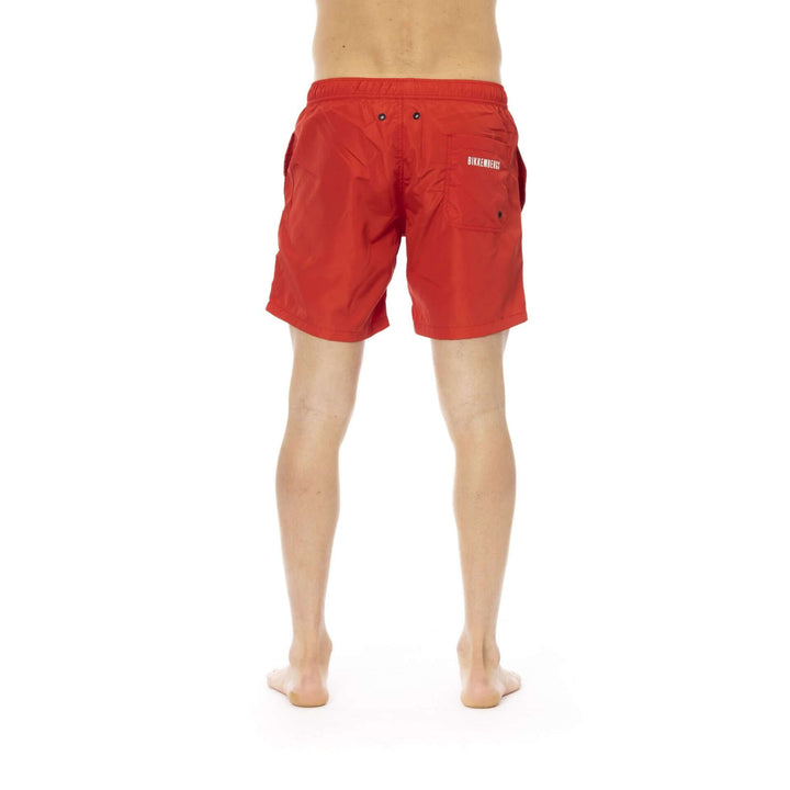 Men’s Bikkembergs beachwear and swimwear collection at STORE 7994 featuring modern swim trunks and sporty beach styles for summer.