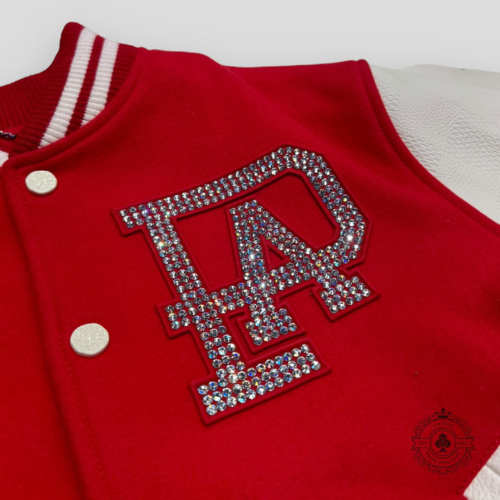 Red letterman jacket with a rhinestone 'AP' logo on a white background