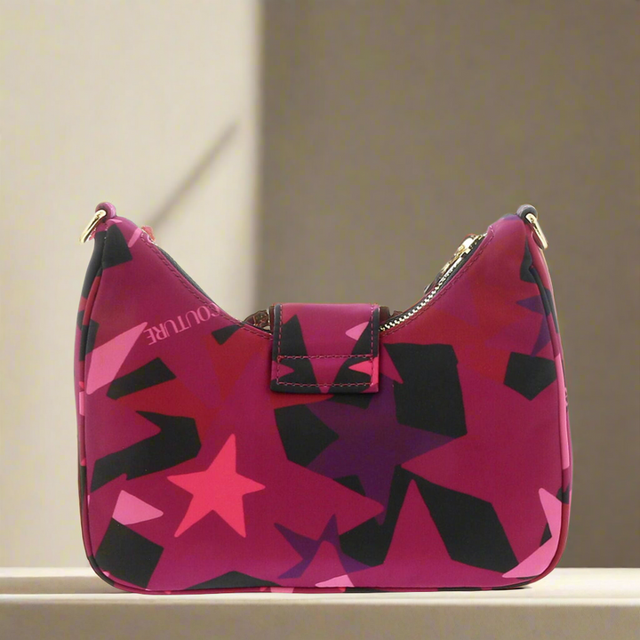 Versace Jeans Couture shoulder bag in vibrant pink with star pattern and zip closure, perfect for women.