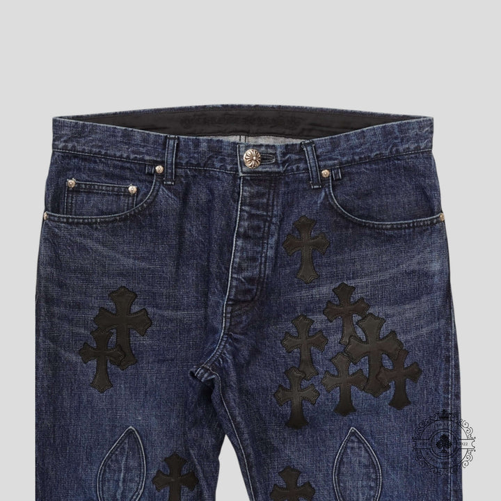 Chrome Hearts Fleur Knee Cross Patch Jeans in Dark Wash/Black showcasing luxury denim craftsmanship and unique cross patches.