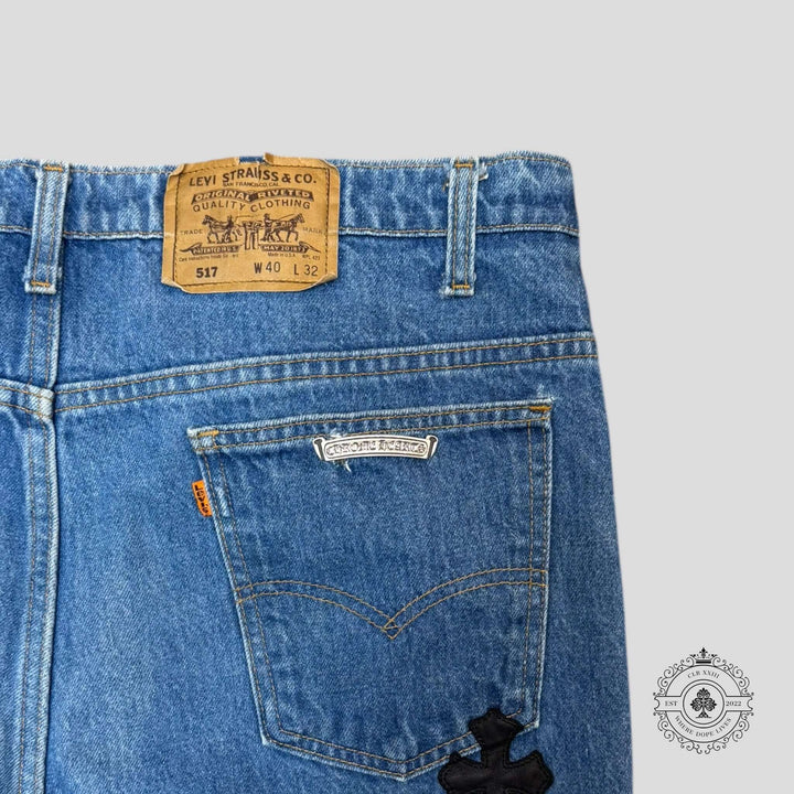Chrome Hearts Cross Patch Levis in excellent condition with dark indigo color and rare .925 sterling silver hardware.
