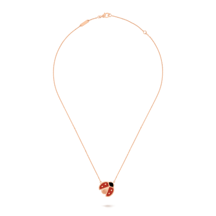 Van Cleef & Arpels Lucky Spring pendant, open wings ladybug 18K rose gold, Carnelian, Onyx on a delicate chain.