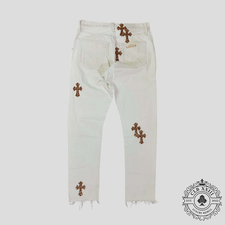 Chrome Hearts Leopard Cross Patch Jeans in White showcasing unique cross patches and distressed details.