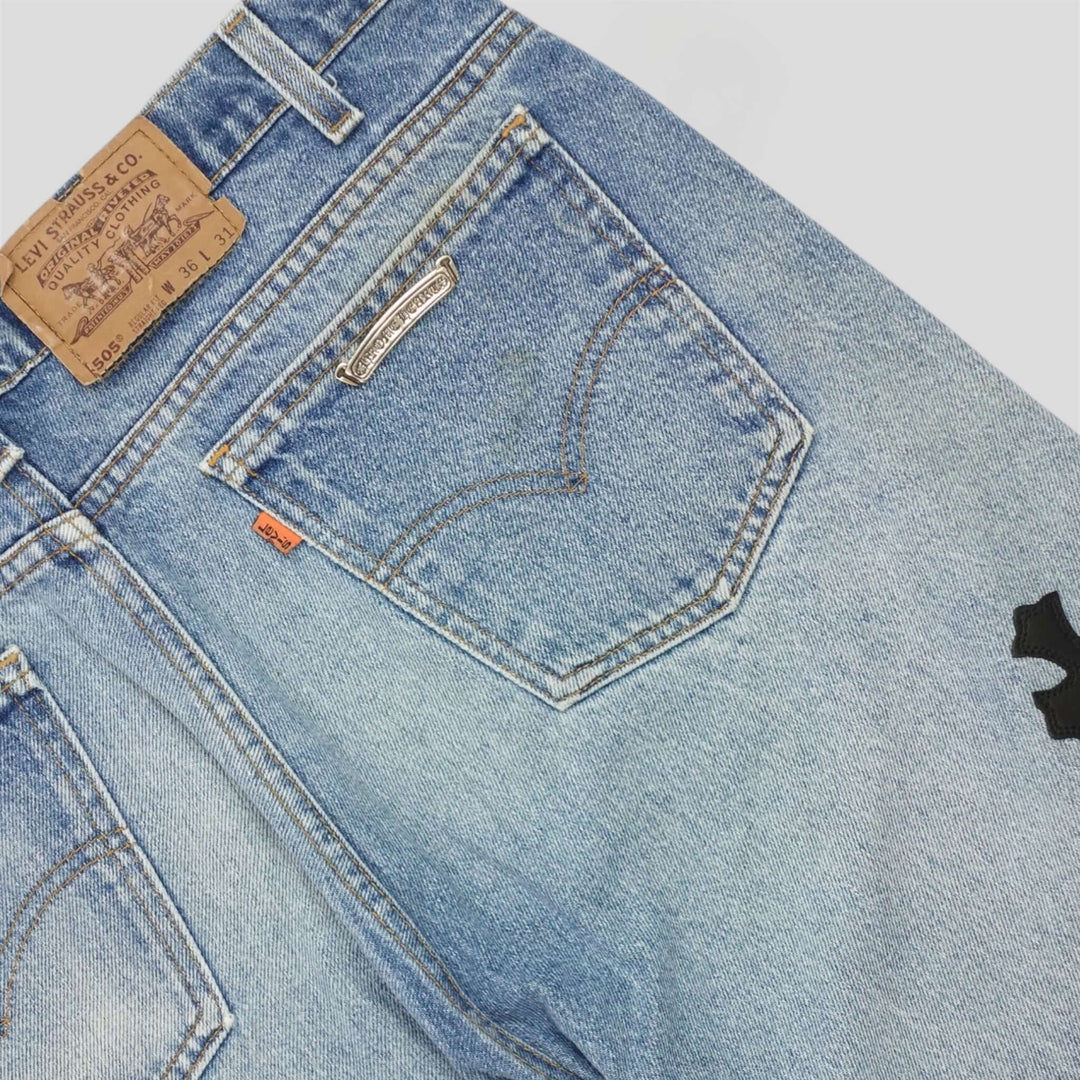 Chrome Hearts Cross Patch Jeans showcasing unique back pocket design and authentic label detail.