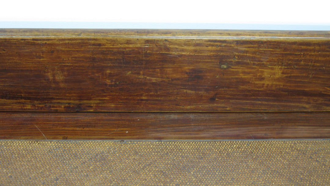 Close-up of a wooden surface with a textured brown finish