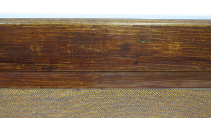 Close-up of a wooden surface with a textured brown finish