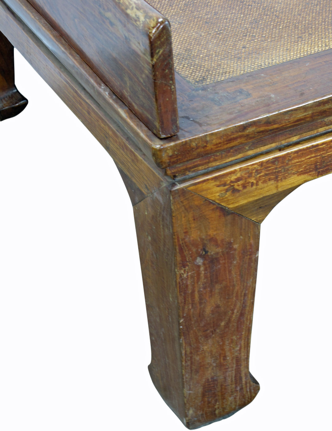 Close-up of a wooden chair with a worn surface on a white background