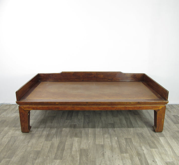 Wooden tray on a gray floor with a white background