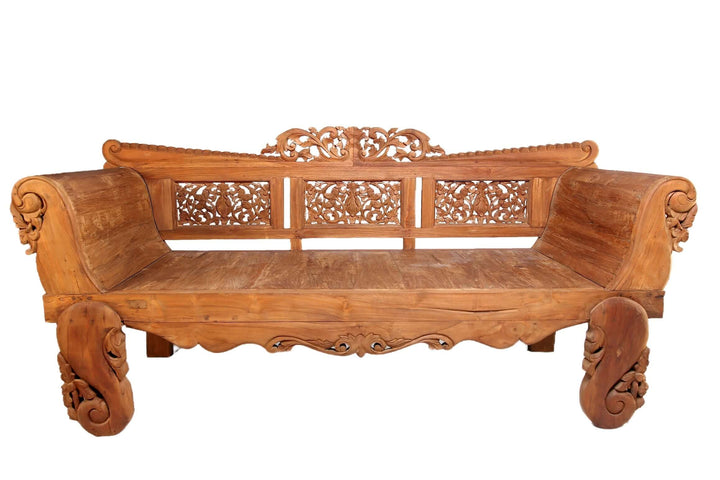 Wooden carved sofa on a white background