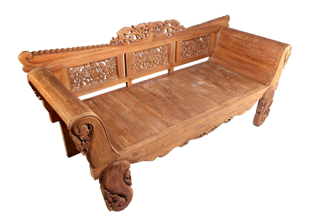 Wooden carved bench on a white background