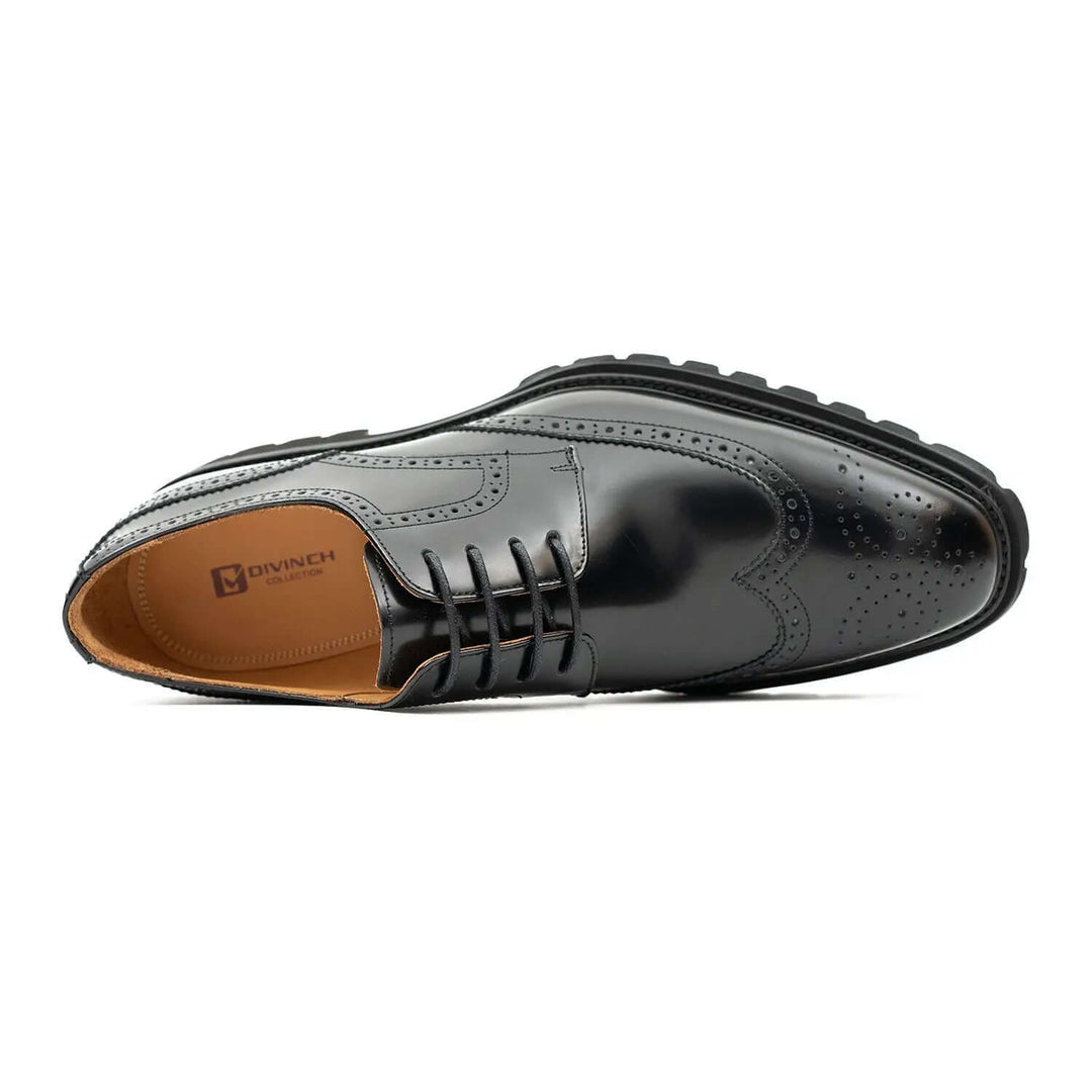 Black derby brogue shoes by DV DIVINCH, featuring polished calfskin leather, intricate brogue details, and a rubber sole.