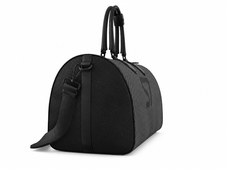 S7 Carbon Noir leather duffle bag with a graphite carbon-fiber-inspired print, centered black S7 monogram, black handles and solid black end panels.