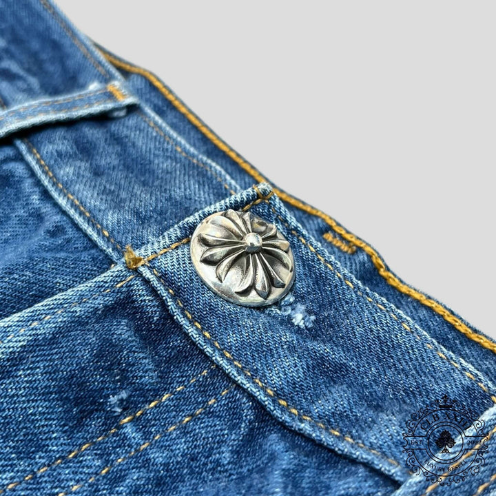 Close-up of the button on Chrome Hearts Levi Patch Jeans in Black/Blue/White, showcasing the luxury denim craftsmanship.