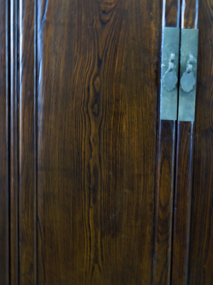 Close-up of a wooden door with a metal handle