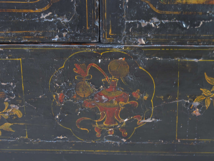 Decorative black surface with red and gold artwork