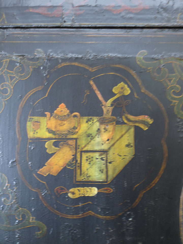 Decorative emblem on a dark surface with gold and yellow details