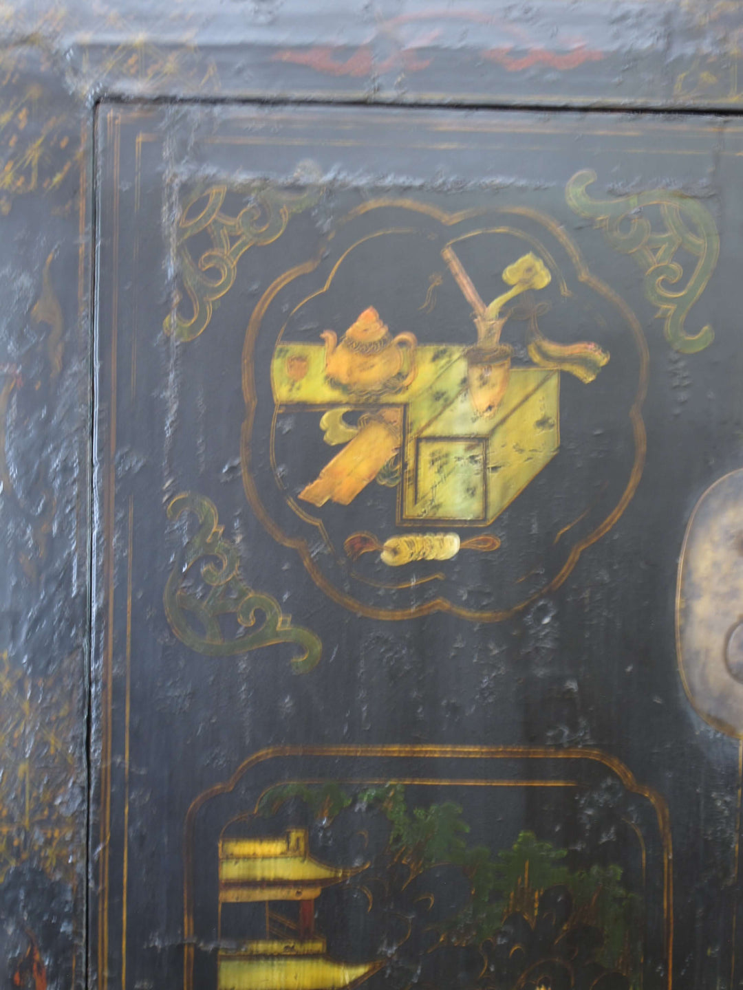 Decorative box with gold intricate designs on a dark background