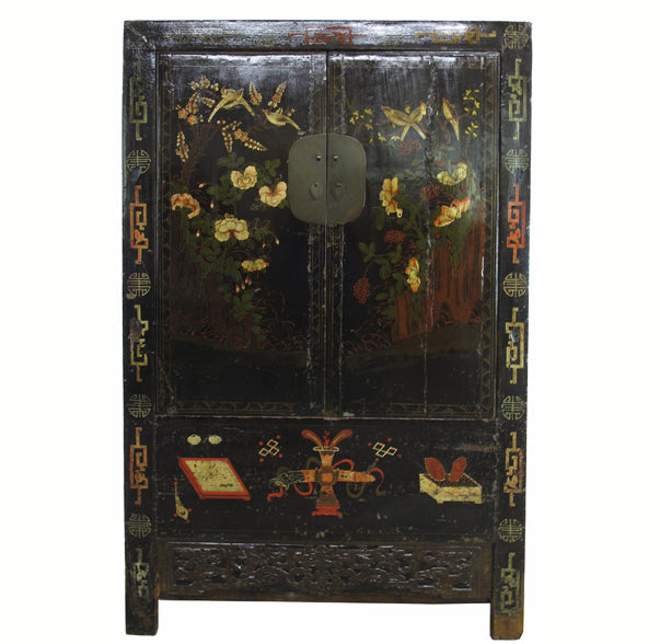 Decorative wooden cabinet with floral and butterfly patterns on a white background