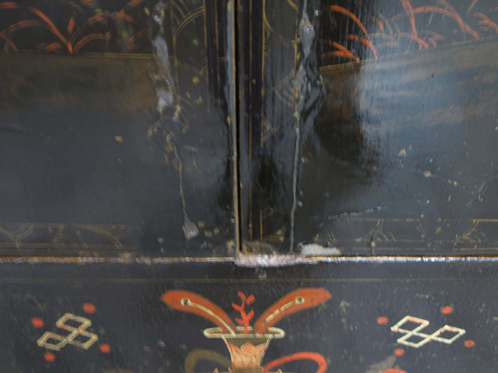 Decorative black surface with red and gold patterns