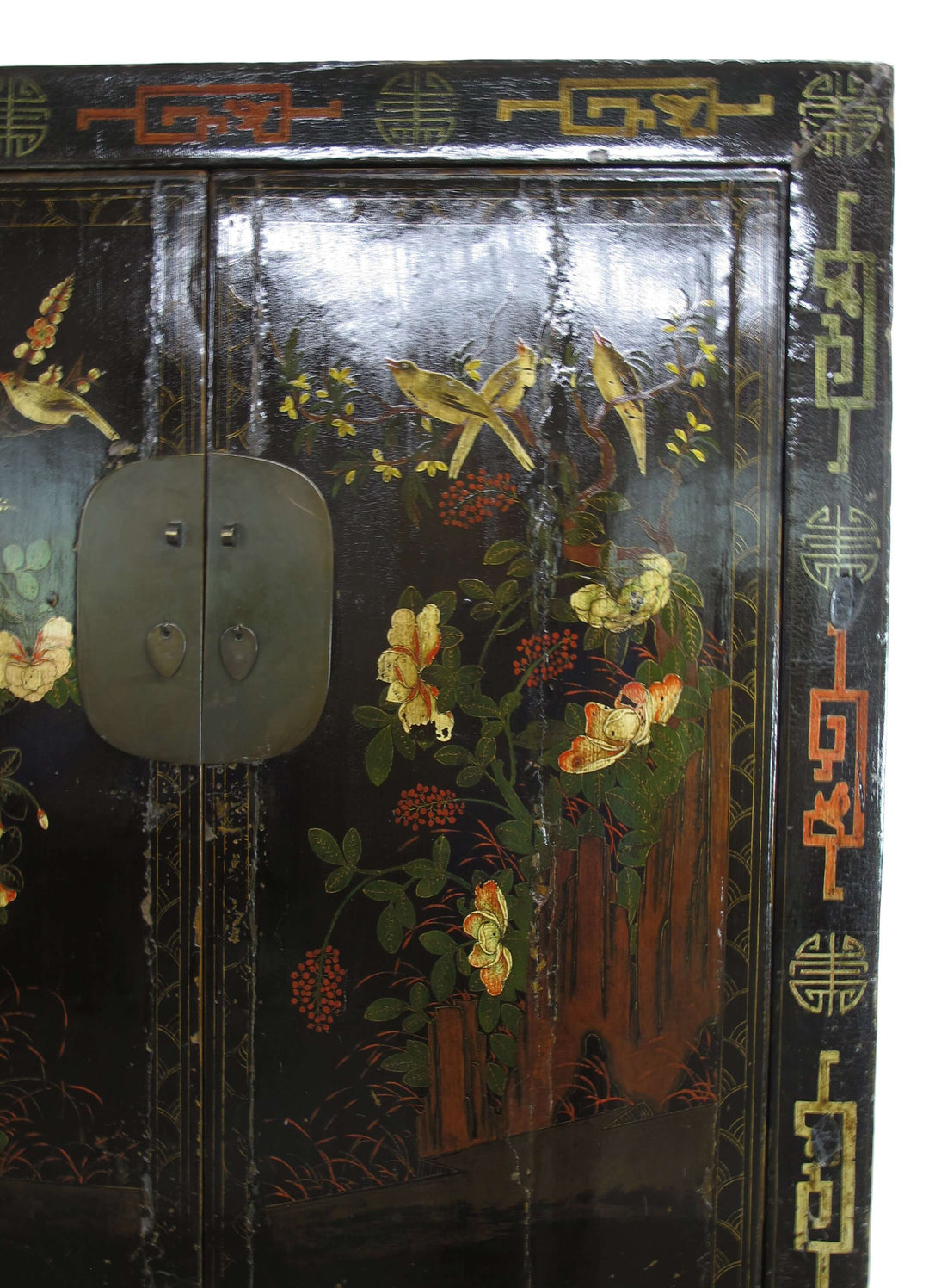 Decorative wooden cabinet with floral and bird patterns on a black background