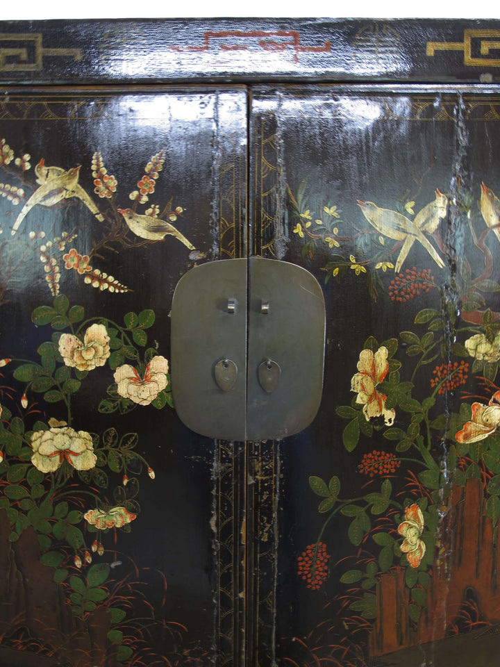 Decorative cabinet with floral and bird patterns on a black background