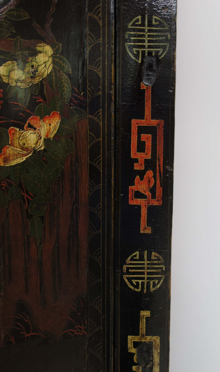 Decorative wooden panel with floral design and Chinese characters on a white background