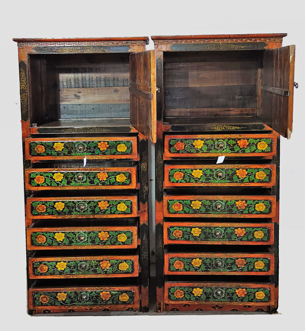 Wooden cabinet with floral patterns on a white background