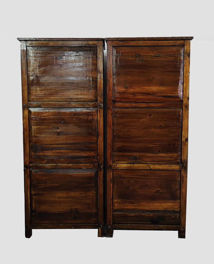 Wooden wardrobe with a rustic finish on a white background