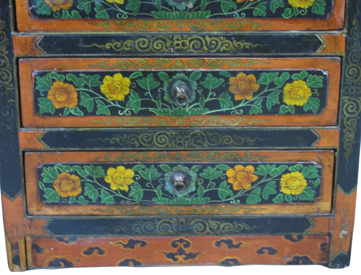 Decorative wooden chest with floral patterns and colorful paint