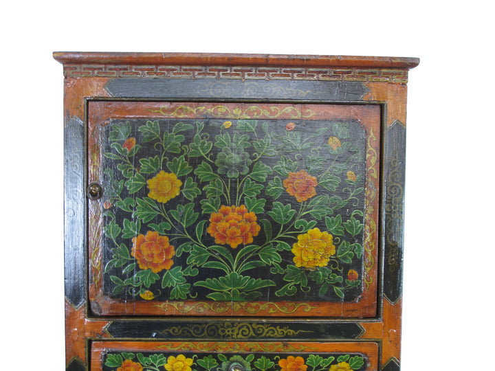 Wooden cabinet with floral designs on a white background