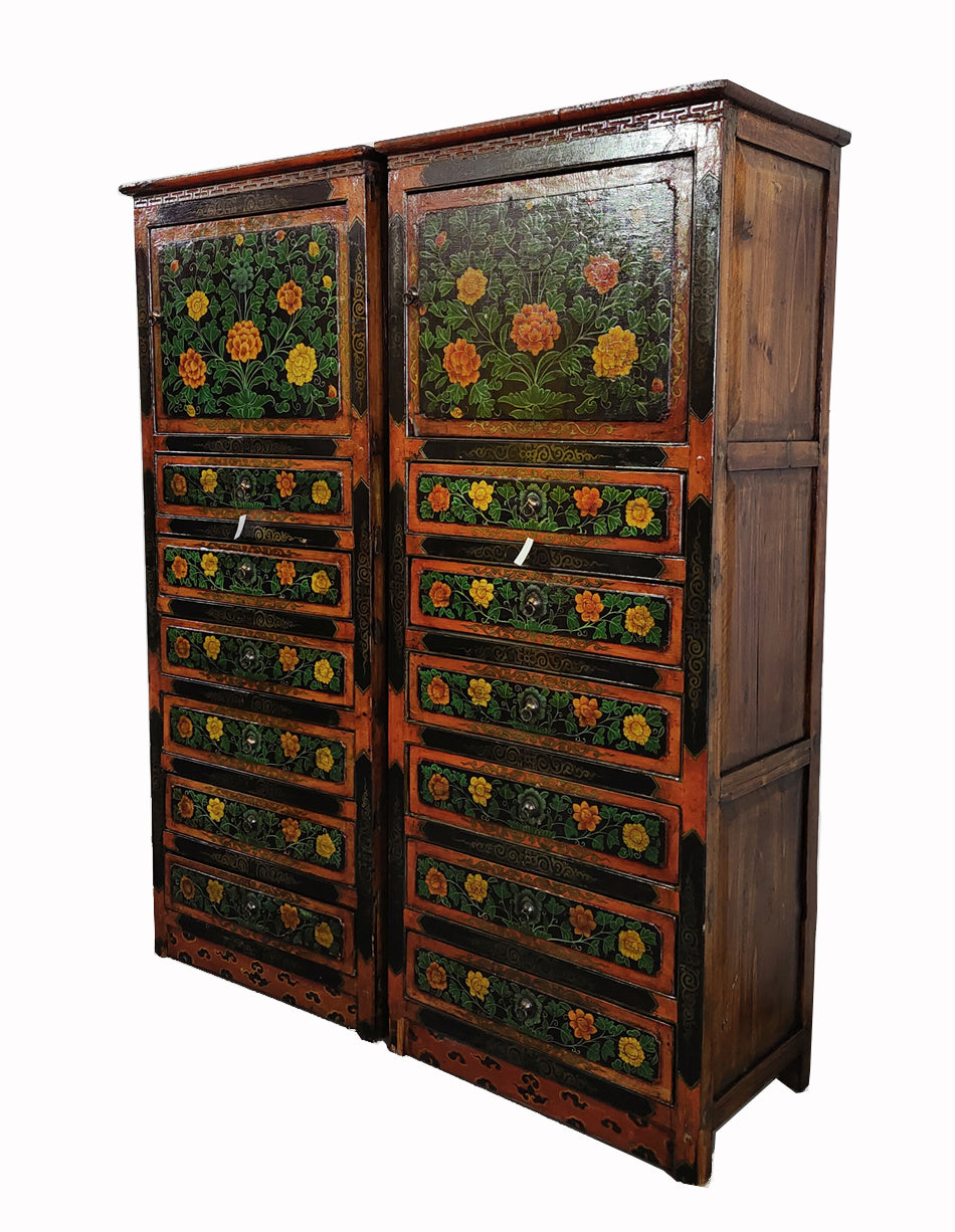 Wooden cabinet with floral designs on a white background