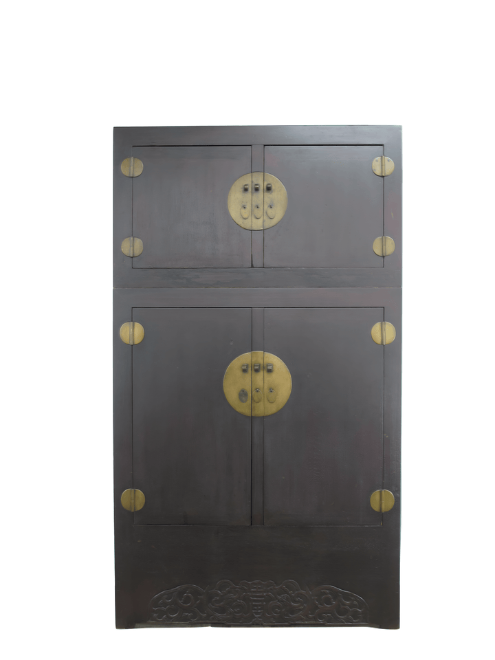 Dark wooden cabinet with brass circular handles on a white background